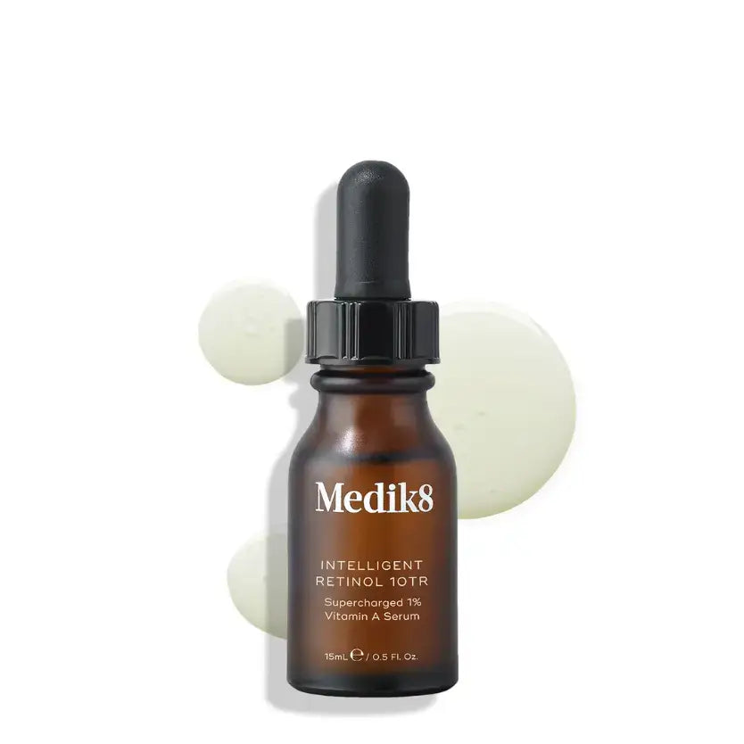 Medik8™ Intelligent Retinol 10TR vitamin A serum with dropper and cream texture on a surface.