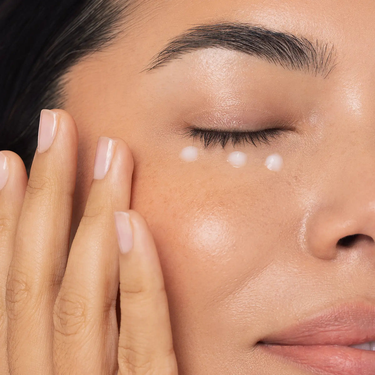 IMAGE Skincare MD Restoring Eye Recovery Gel dotted under the eye by a model