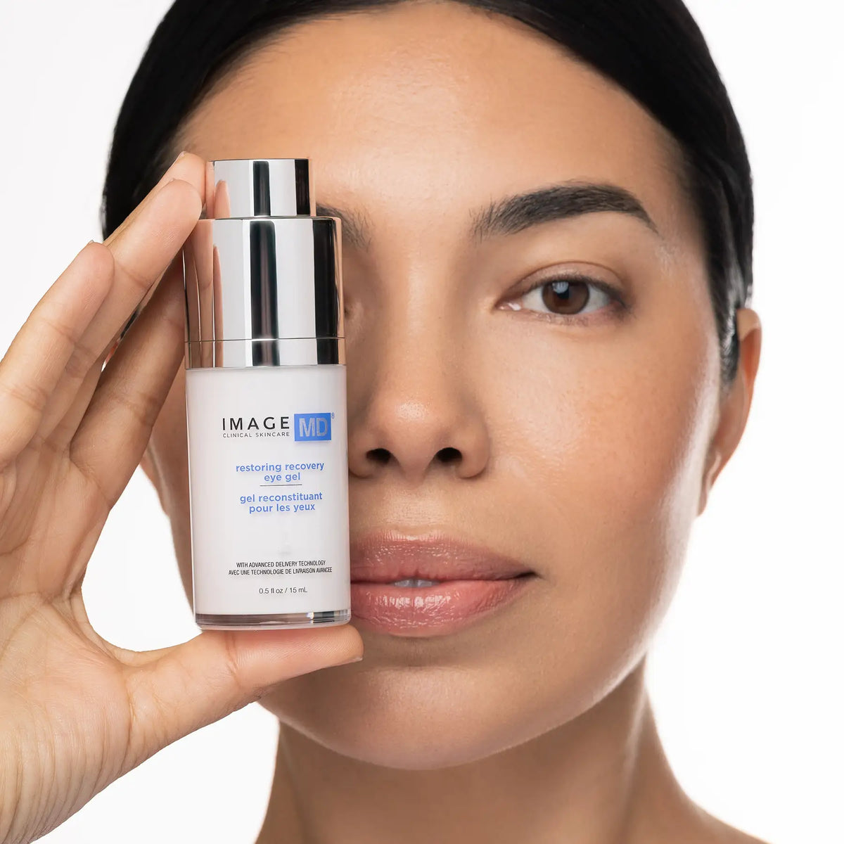 IMAGE Skincare MD Restoring Eye Recovery Gel held by a model