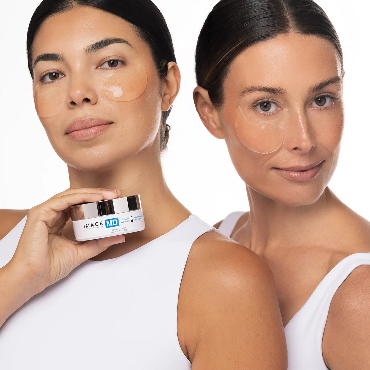 IMAGE Skincare MD Restoring Eye Masks worn by two models holding the jar