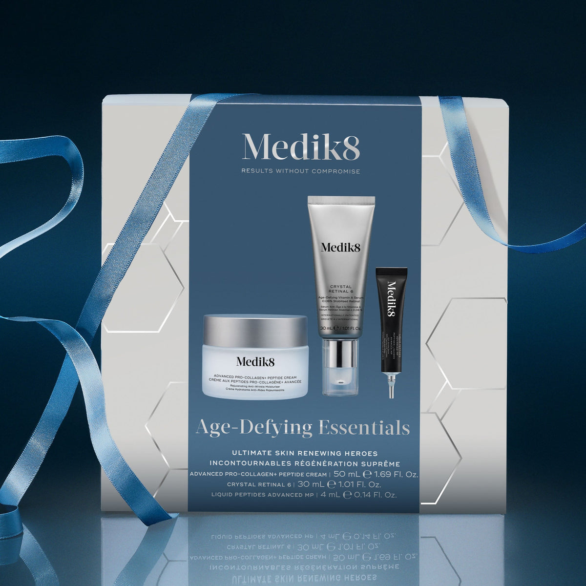 Medik8 Age-Defying Essentials festive gift box wrapped in blue ribbon
