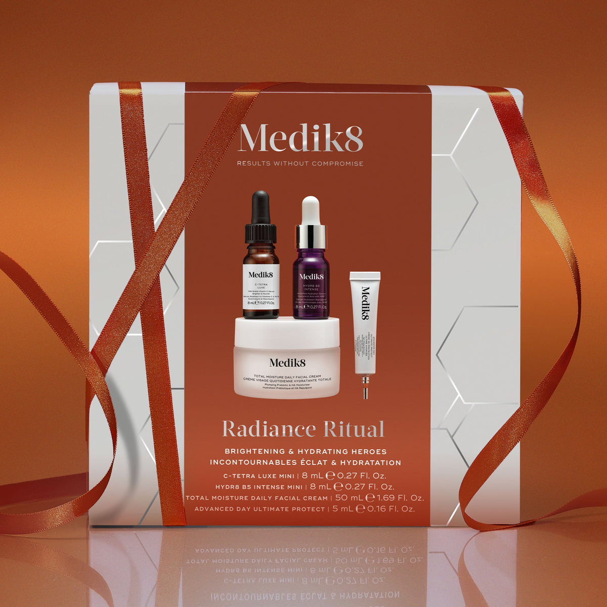 Medik8 Radiance Ritual festive gift box wrapped in orange ribbon