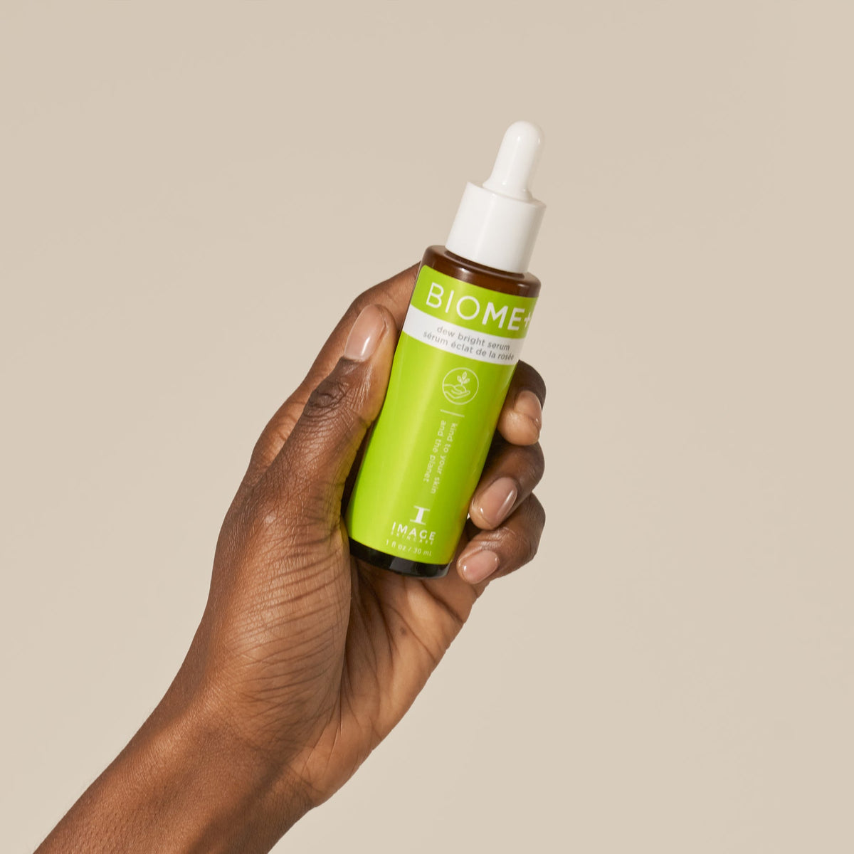 IMAGE Skincare BIOME+ Dew Bright Serum bottle held in hand