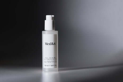 Medik8 Total Moisture Daily Cleansing Gel bottle on a minimalistic background
