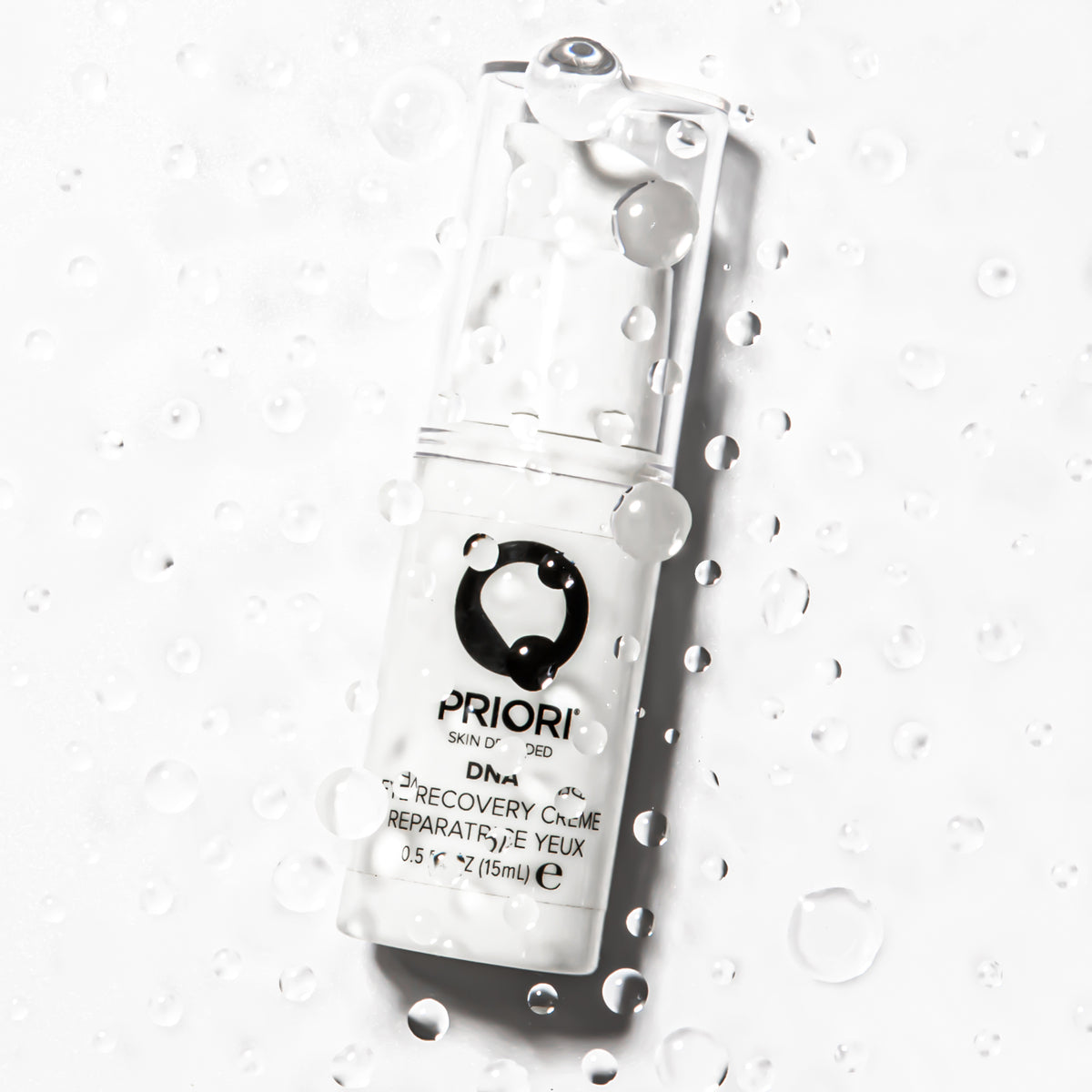 PRIORI DNA Eye Recovery Crème 15ml pump bottle with water droplets