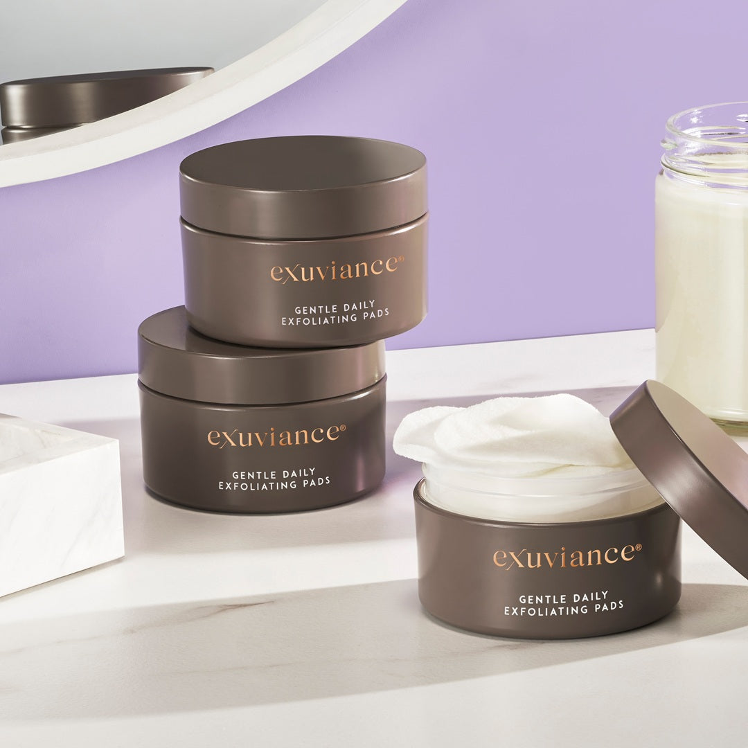 Exuviance Gentle Daily Exfoliating Pads swiped across the face