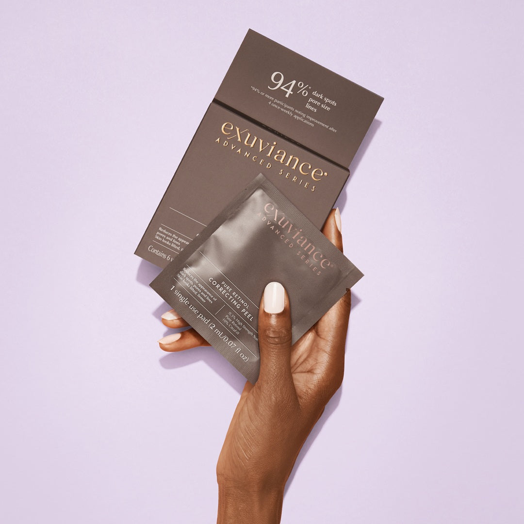 Exuviance Pure Retinol Correcting Peel Pads single sachet in hand