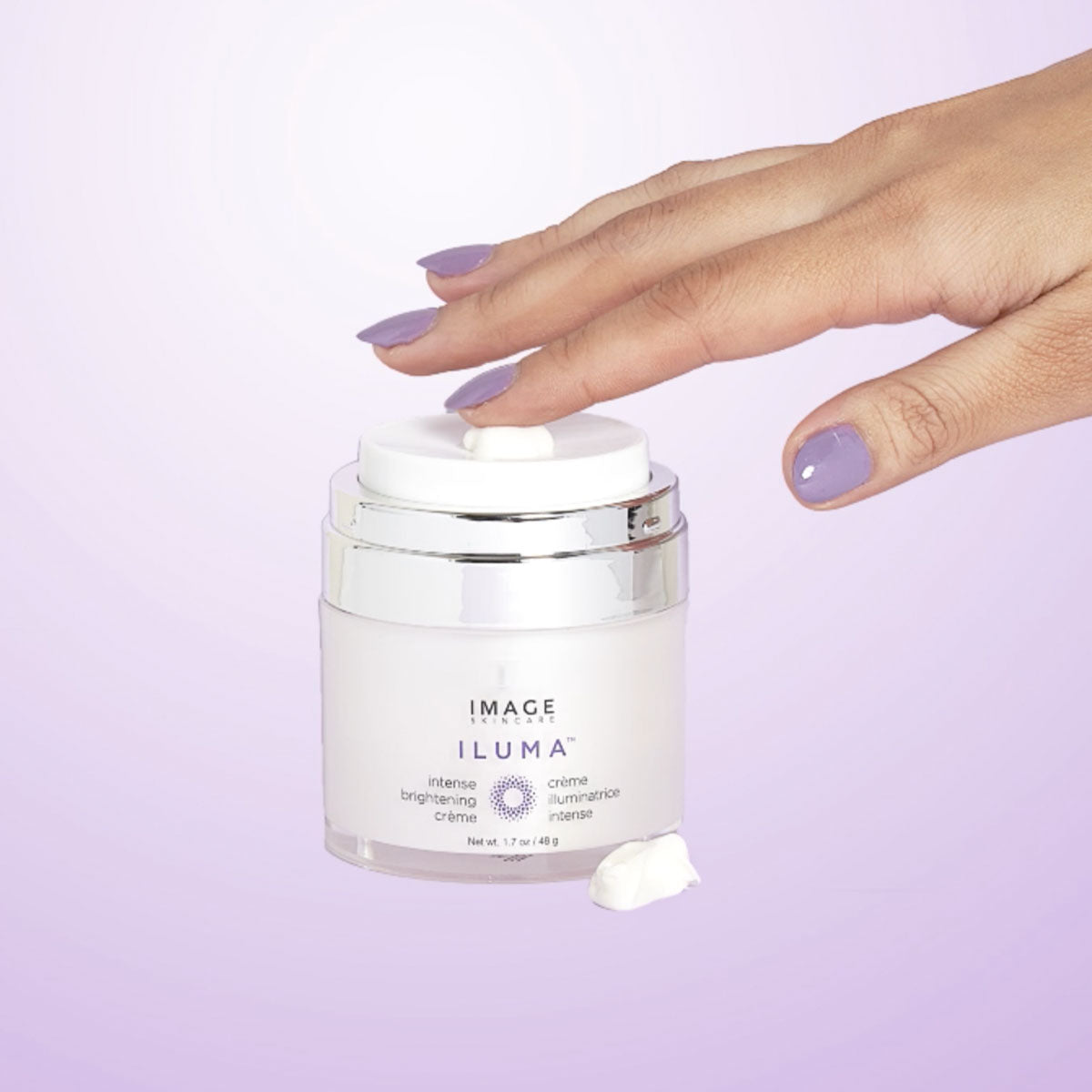 IMAGE Skincare ILUMA Intense Brightening Crème jar opened with crème on fingertip
