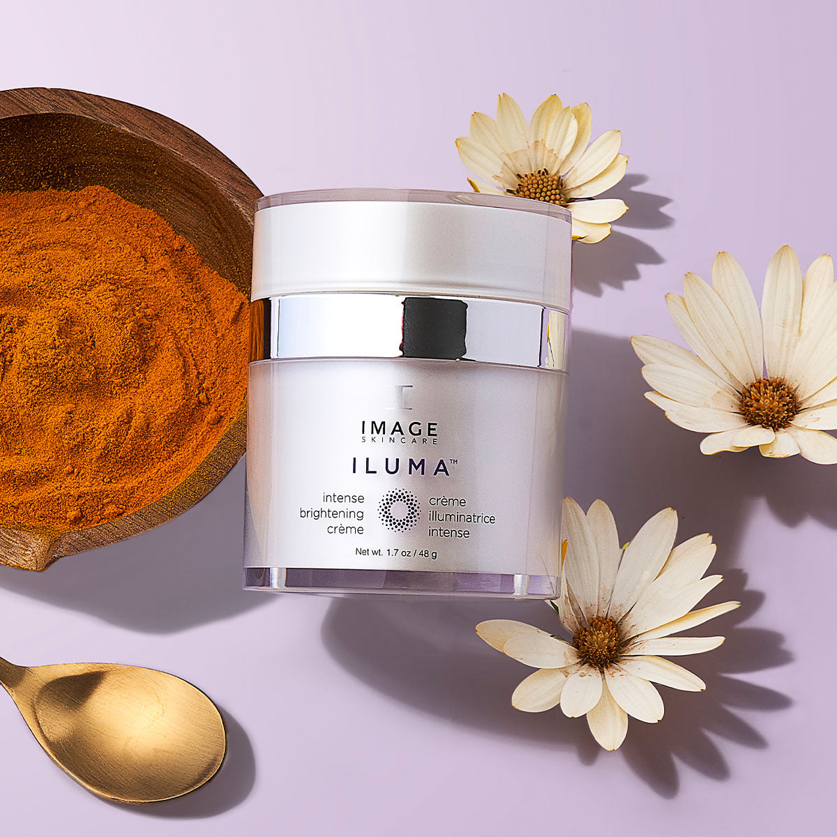 IMAGE Skincare ILUMA Intense Brightening Crème jar with turmeric and daisy flowers