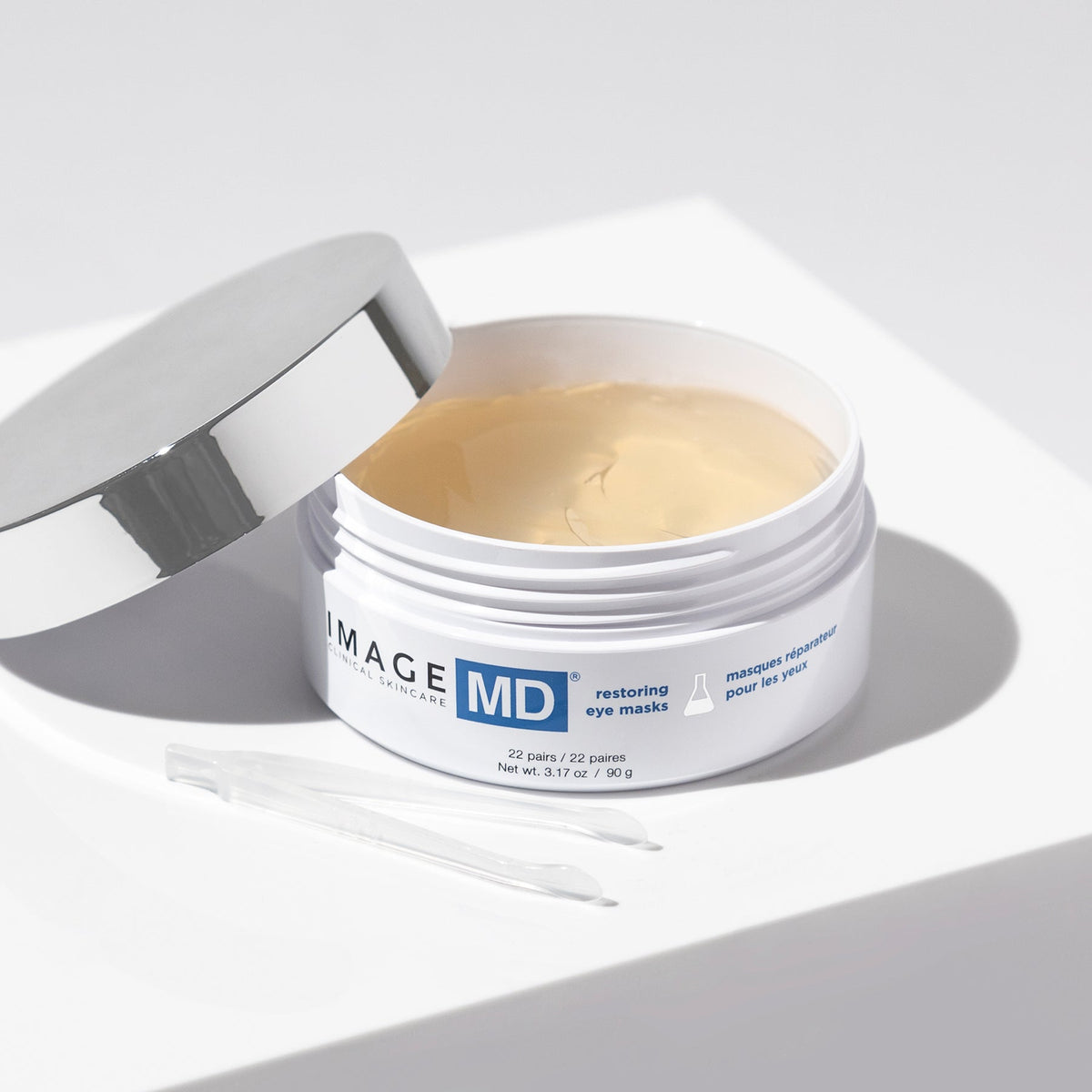 IMAGE Skincare MD Restoring Eye Masks open jar with tweezers