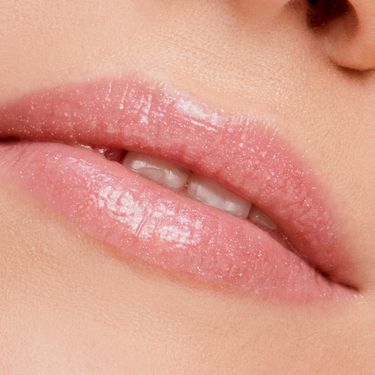 Jane Iredale HydroPure Hyaluronic Lip Gloss in Pink Glace worn on the lips