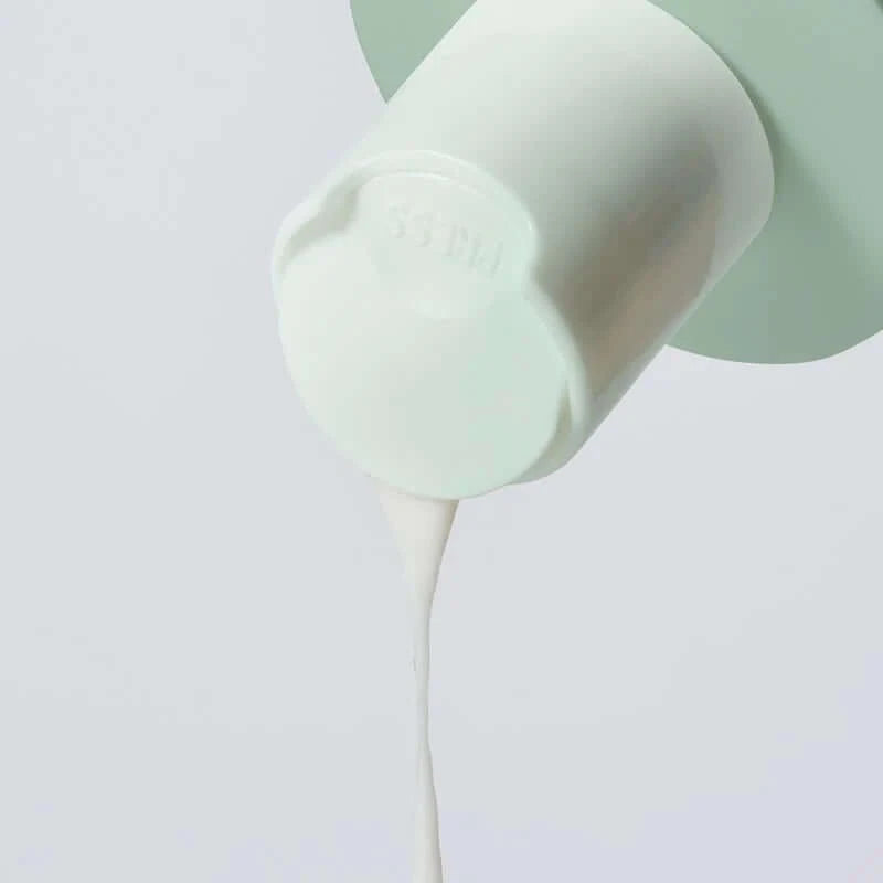 Marini Skin Solutions Bioglycolic Face Cleanser pouring from the container.