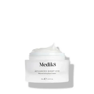 Medik8 Advanced Night Eye rejuvenating eye cream in a jar, designed for dark circles and fine lines.