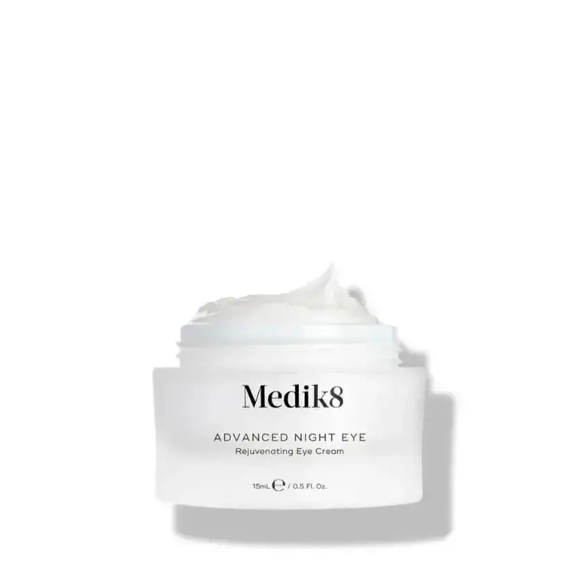 Medik8 Advanced Night Eye rejuvenating eye cream in a jar, designed for dark circles and fine lines.