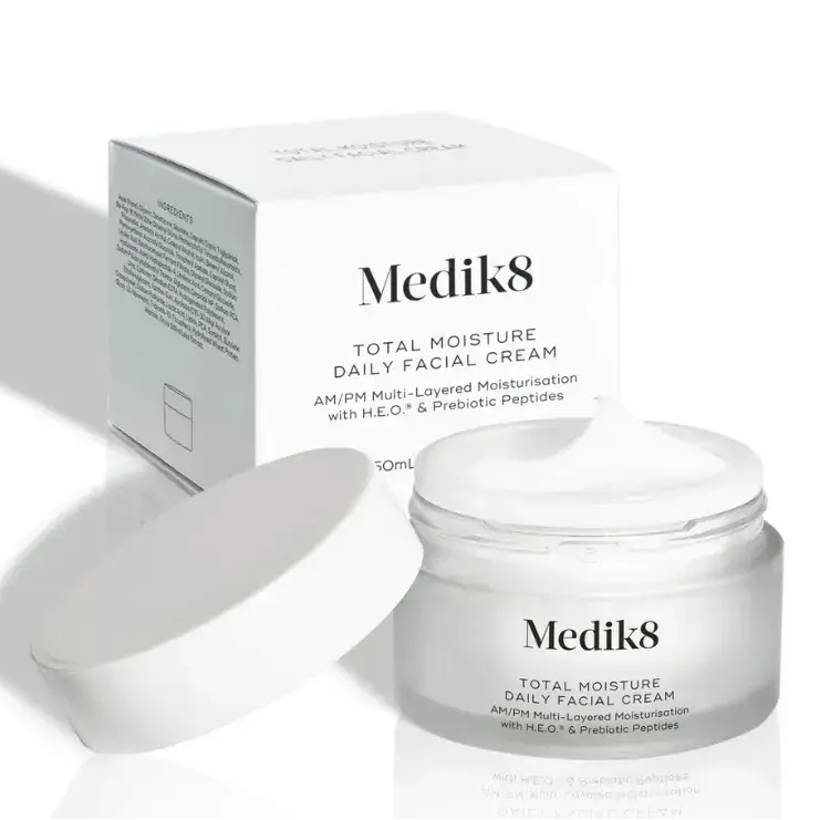 Medik8 Total Moisture Daily Facial Cream™ in a jar with a white lid beside its packaging for intense skin hydration.