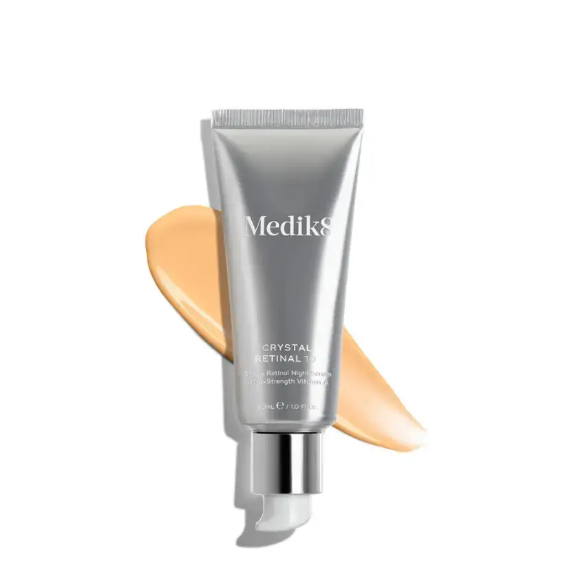 Medik8 Crystal Retinal 10™ advanced retinaldehyde serum with a cream swatch.