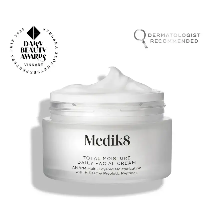 Medik8 Total Moisture Daily Facial Cream™ in jar with cream texture, dermatologist recommended for hydration and skin barrier support.