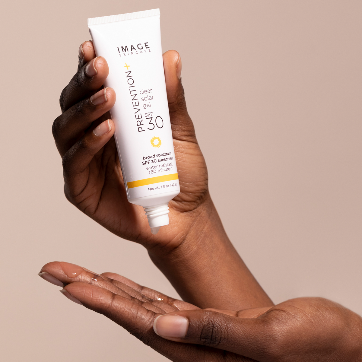 IMAGE Skincare PREVENTION+ Clear Solar Gel SPF 30 tube dispensed into the hand