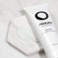 PRIORI LCA fx161 Hydrofill Masque tube on a marble surface with a small amount of product spilled.