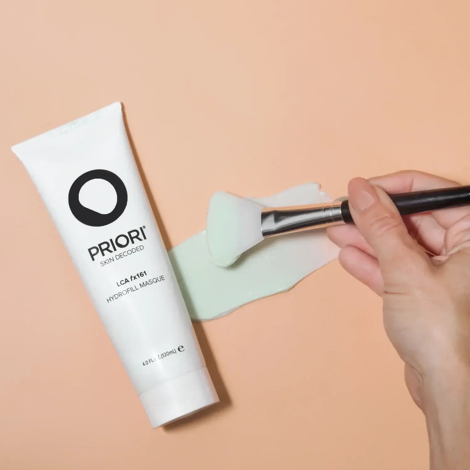 PRIORI LCA fx161 Hydrofill Masque being applied with a brush on a smooth surface.