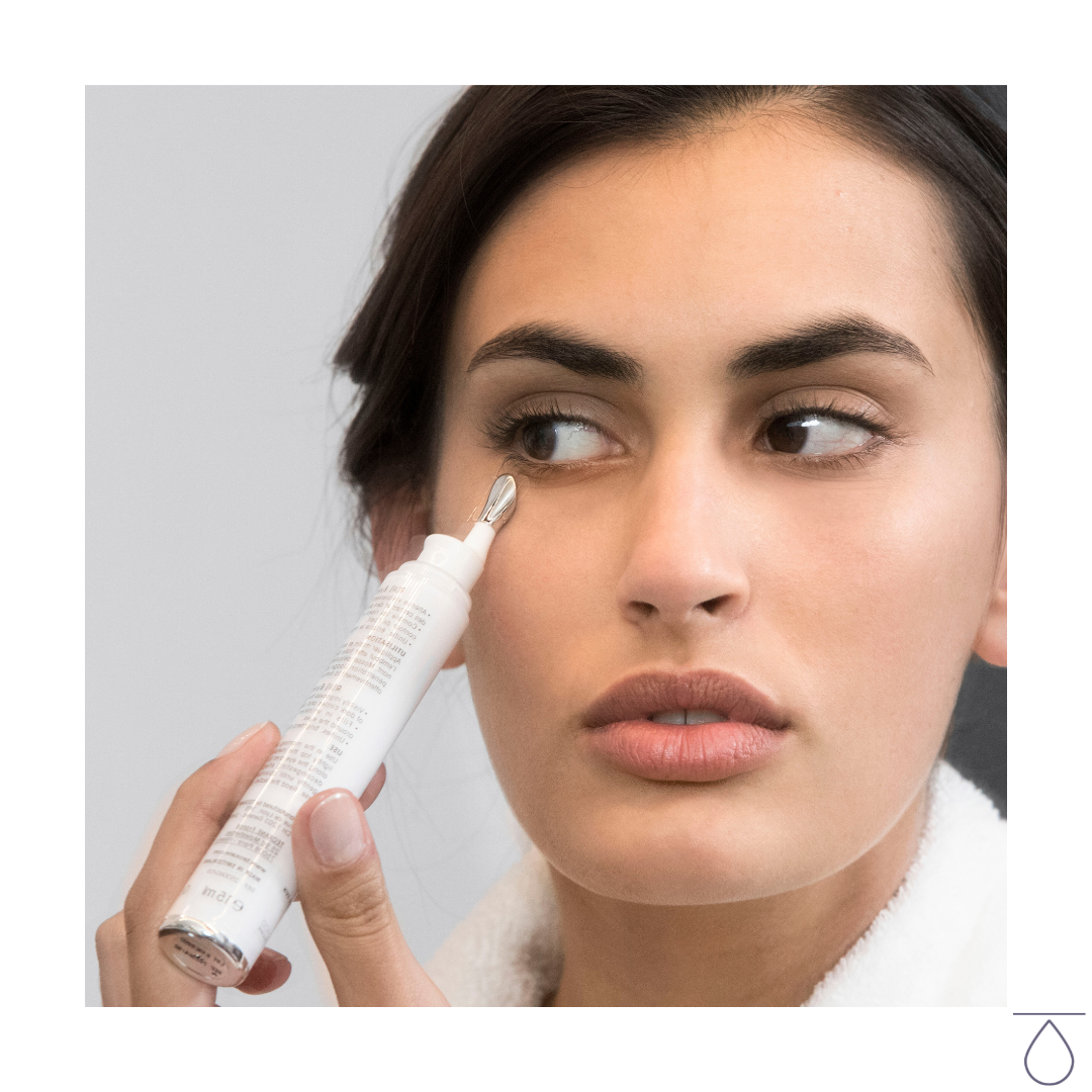 Woman applying Teoxane RII Eyes with the cooling metal applicator under the eye