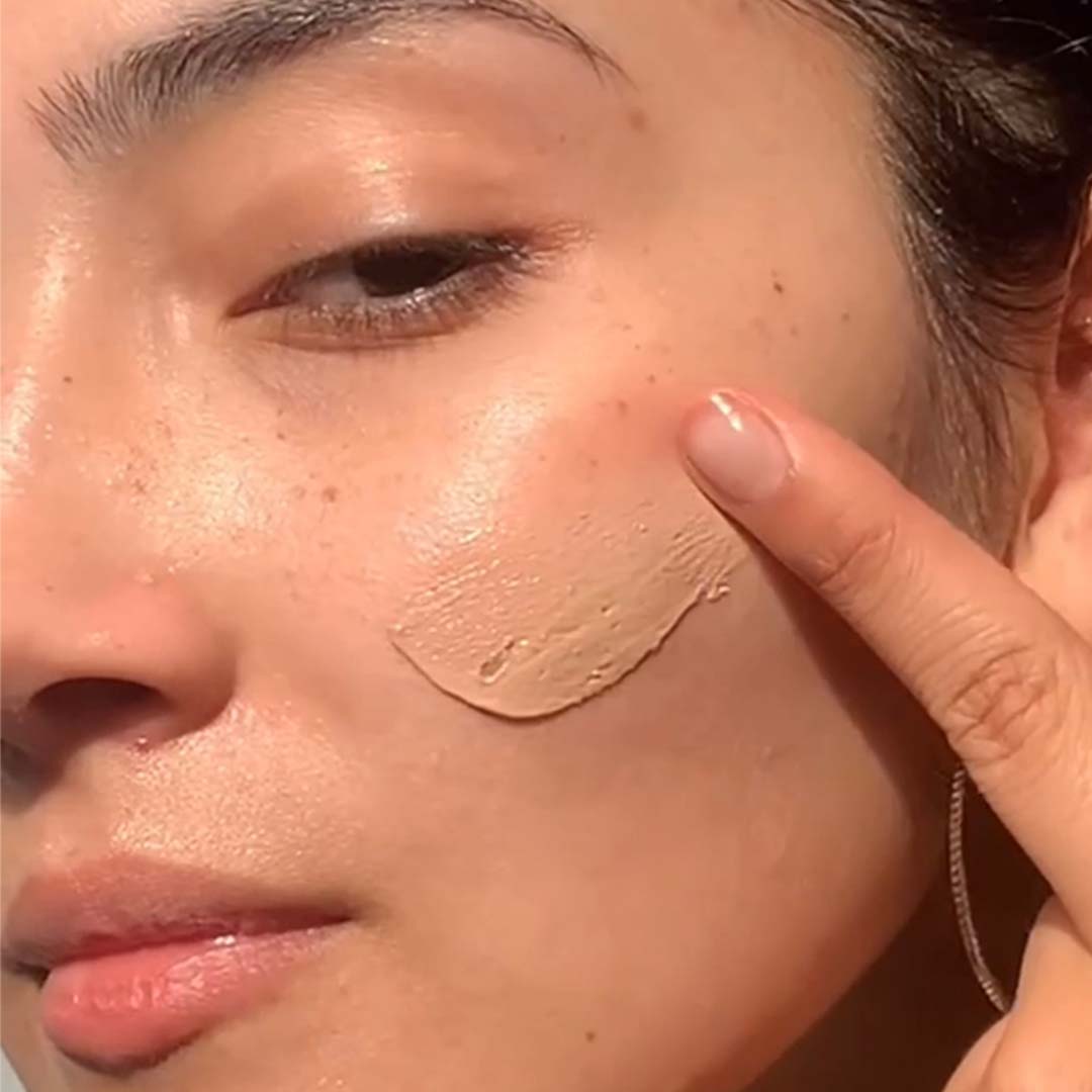 PRIORI Tetra Tinted Day Shield tinted texture blended on the cheek