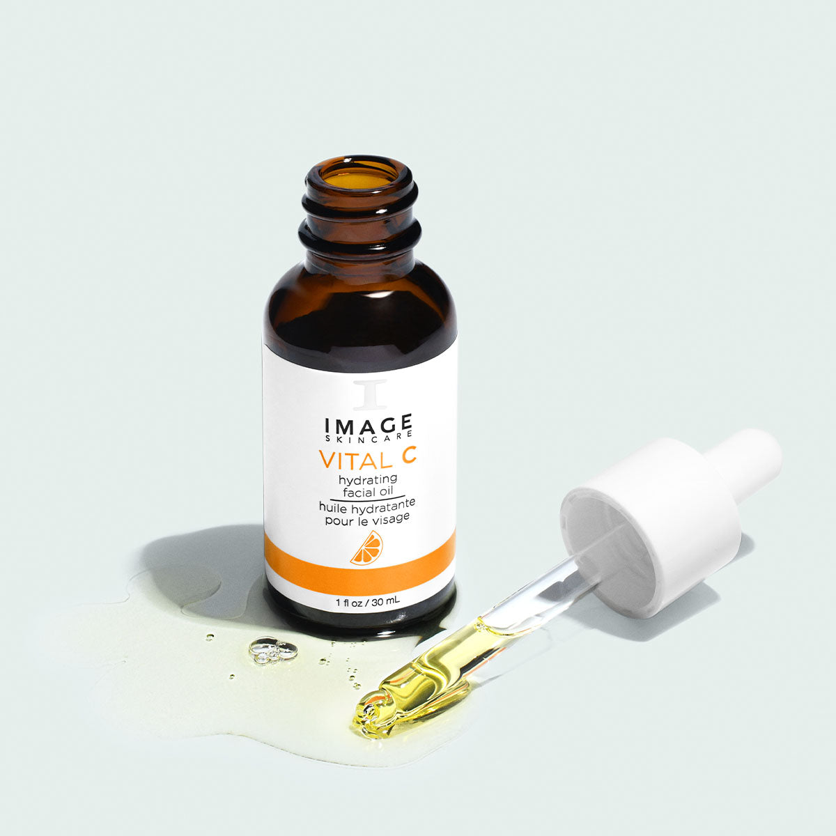 IMAGE Skincare VITAL C Hydrating Facial Oil open bottle with dropper and oil drops
