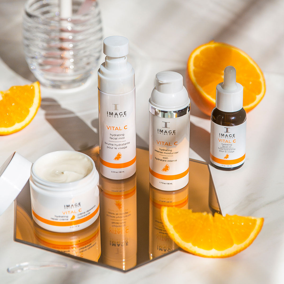 IMAGE Skincare VITAL C Hydrating Facial Oil with the VITAL C range and fresh orange slices