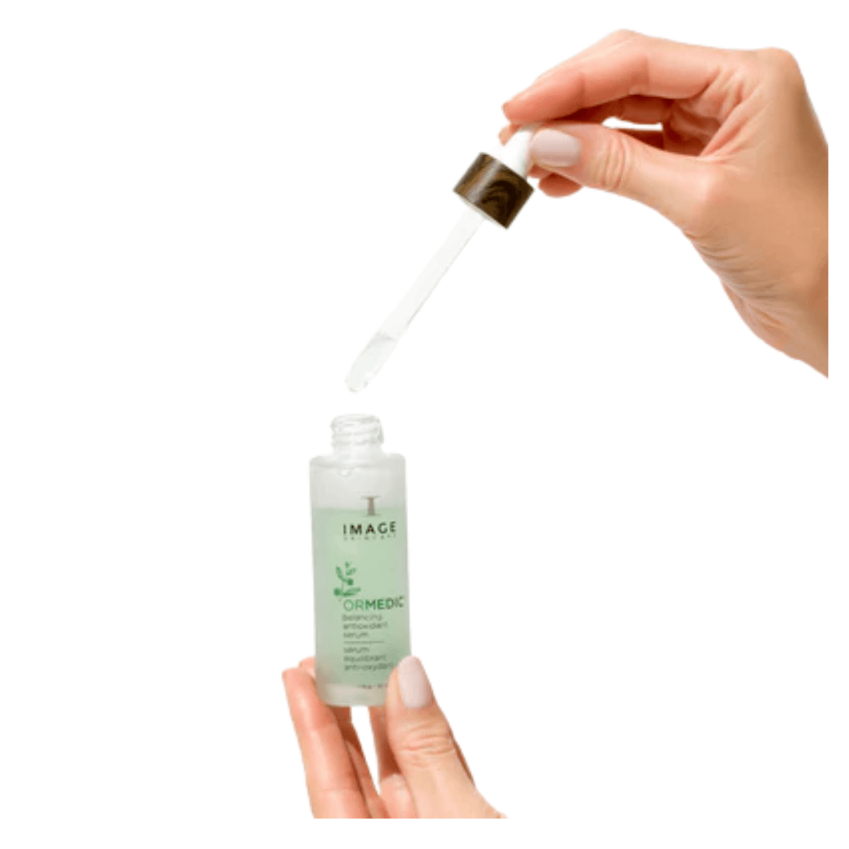 IMAGE Skincare ORMEDIC Balancing Antioxidant Serum dropper held above the bottle showing the lightweight serum