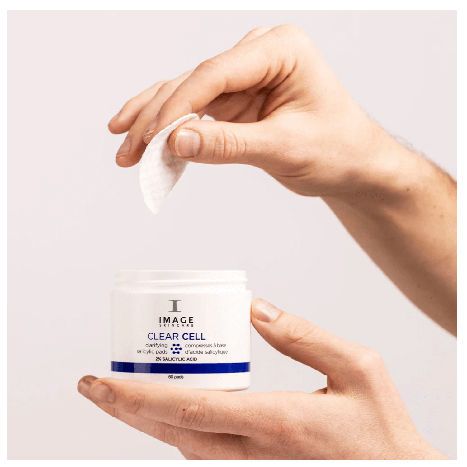 IMAGE Skincare CLEAR CELL Salicylic Clarifying Pads in hand, showcasing travel-friendly exfoliating pads.