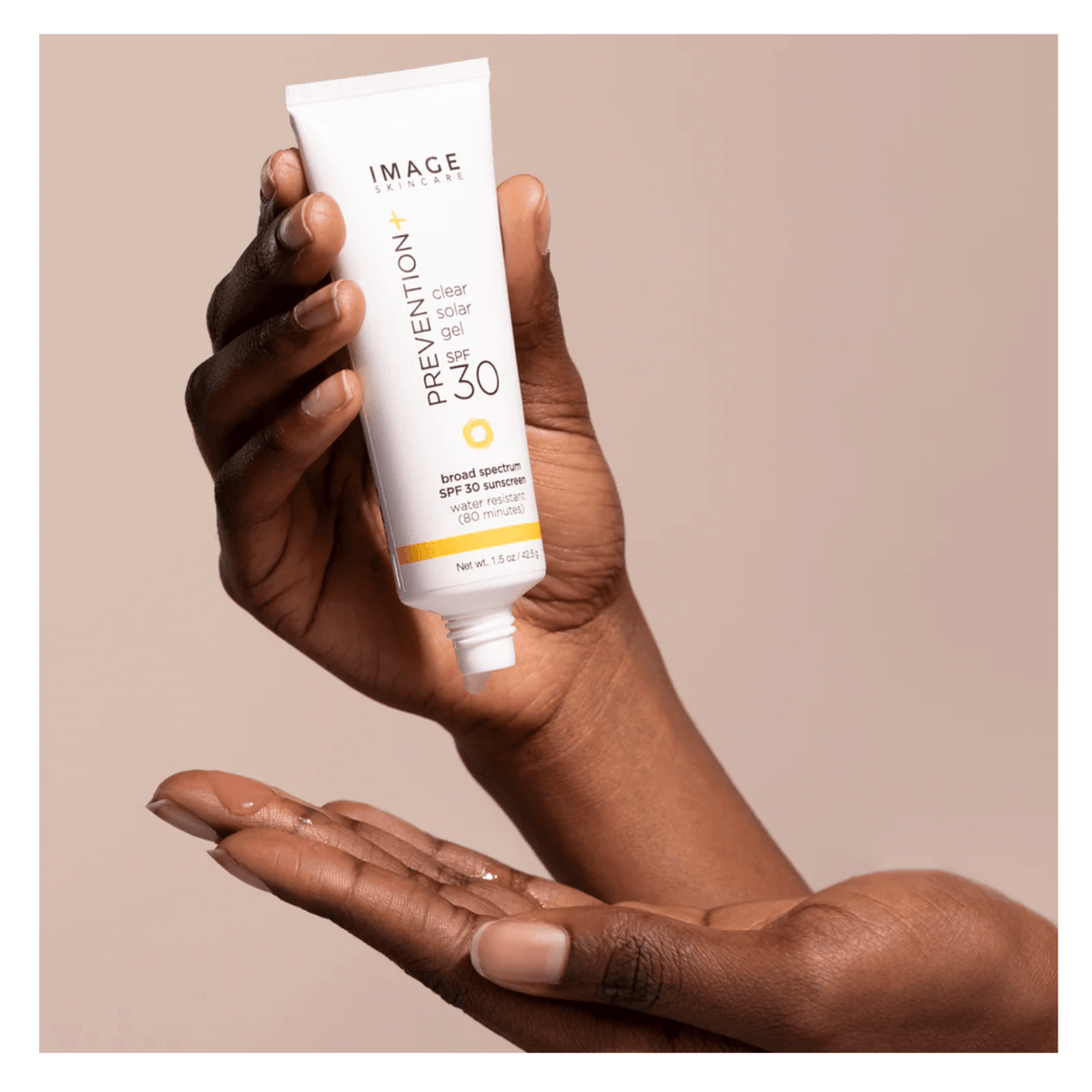 IMAGE Skincare PREVENTION+ Clear Solar Gel SPF 30 in a hand, showcasing its clear and waterless sunscreen formula.