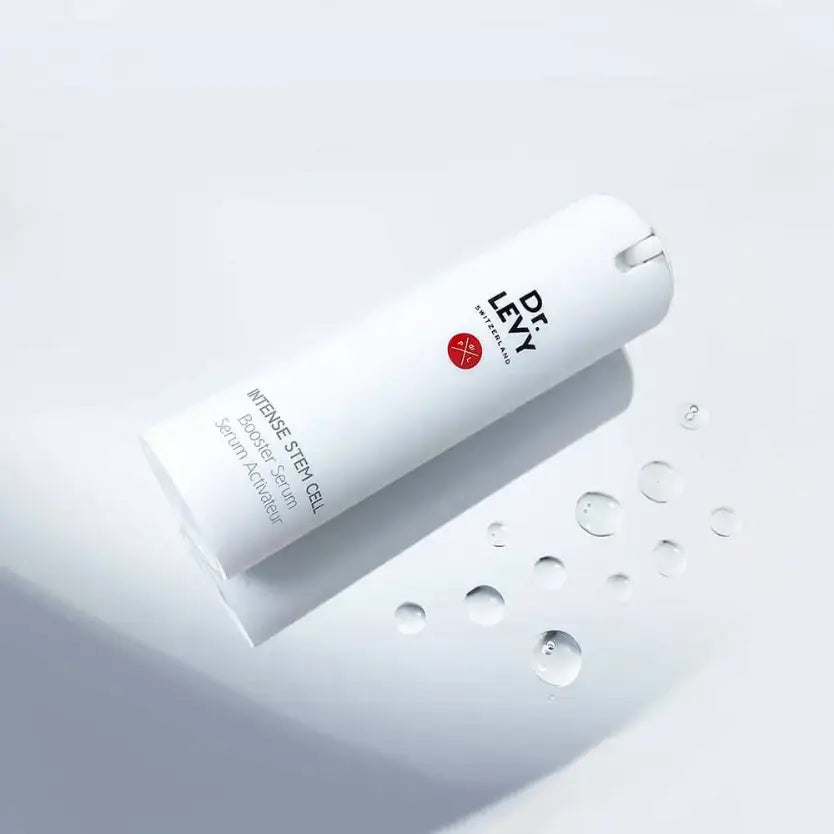 Dr LEVY Intense Cell Booster Serum bottle with drops of serum on a light background.