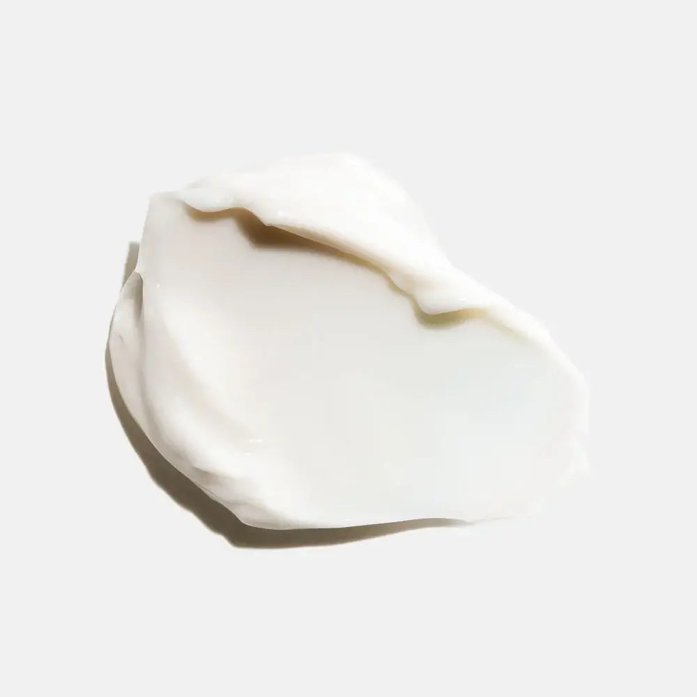 Creamy texture of HydroPeptide Power Lift moisturizer on a flat surface.