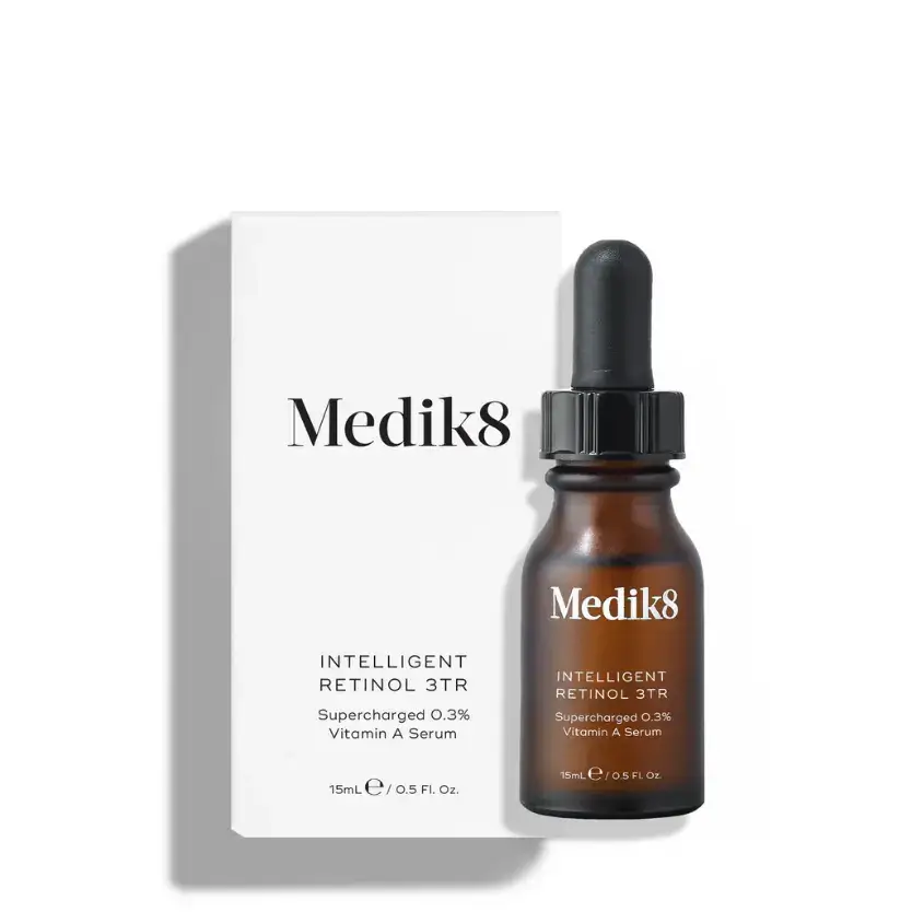 Medik8™ Intelligent Retinol 3TR serum with 0.3% retinol in a brown bottle next to its packaging.