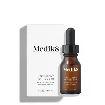 Medik8™ Intelligent Retinol 3TR serum with 0.3% retinol in a brown bottle next to its packaging.