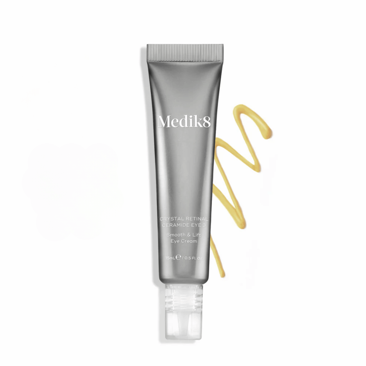 Medik8 Crystal Retinal Ceramide Eye cream tube with cream swirls on a white background, targeting fine lines and wrinkles.