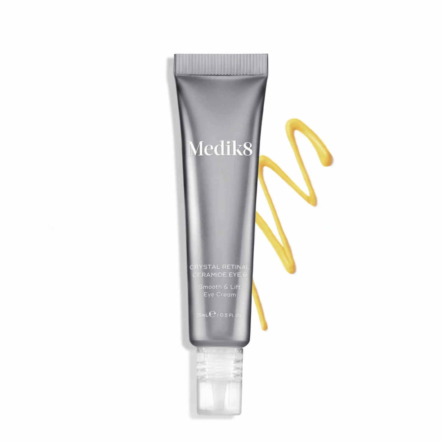 Medik8 Crystal Retinal Ceramide Eye cream tube with smooth golden cream swirl for anti-aging treatment.