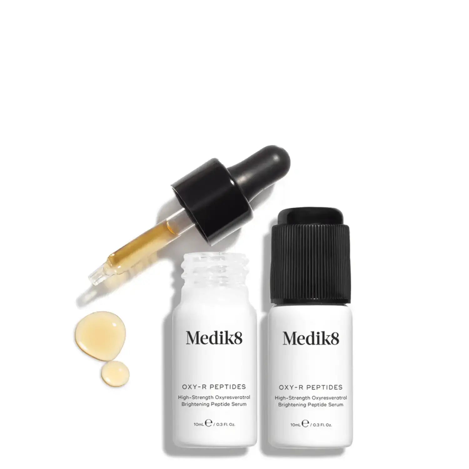 Medik8 Oxy-R Peptides serum with dropper and two bottles on white background.
