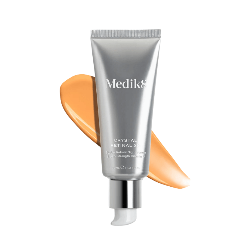 Medik8 Crystal Retinal 20™ cream tube with a vibrant orange cream swirl.