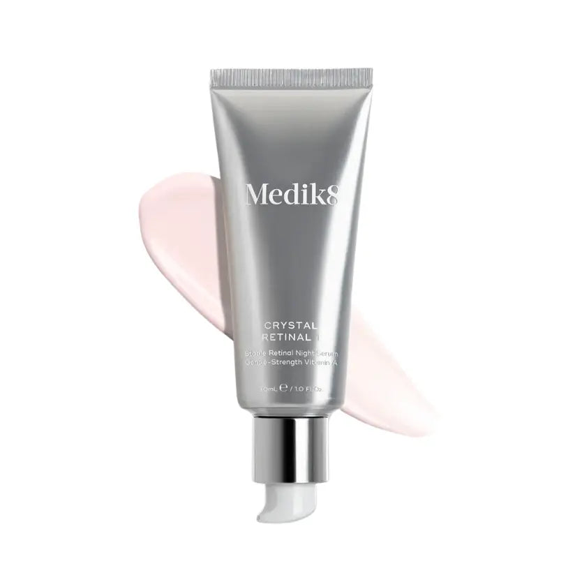 Medik8 Crystal Retinal 1™ tube with a pink cream swipe, designed for sensitive skin at 0.01% strength.