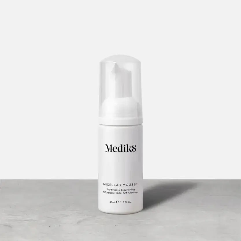 Medik8 Micellar Mousse™ bottle on a countertop with a minimalist design.