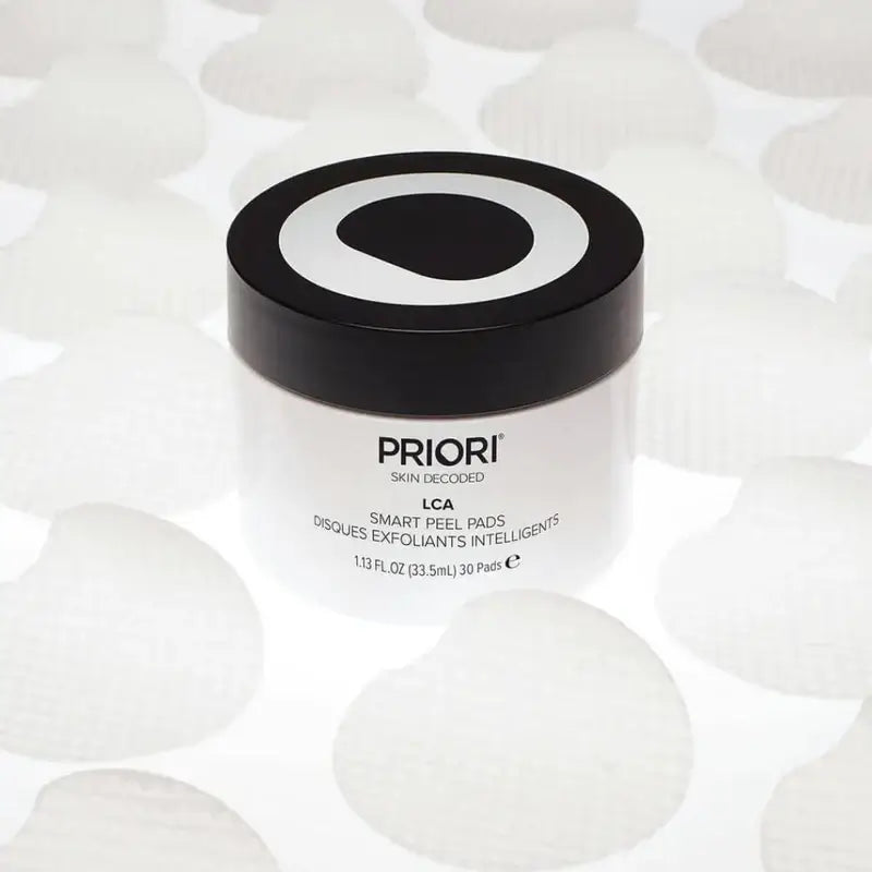 PRIORI Q+SOD Enlightening Peel Pads jar on a smooth background, showcasing professional-strength skincare.