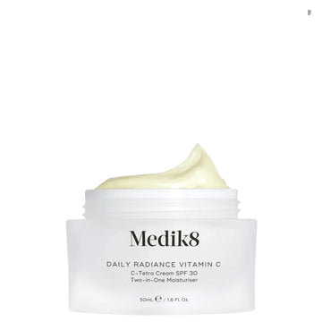 Medik8 Daily Radiance Vitamin C™ jar with cream, featuring 7% Vitamin C and SPF 30 protection.