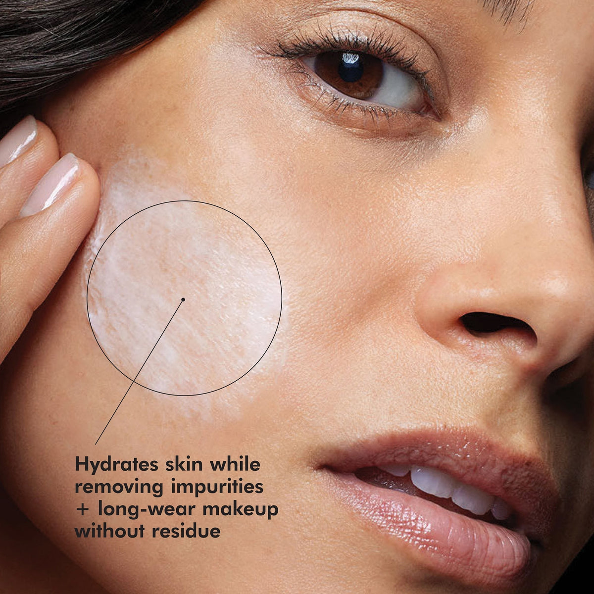 Woman applying SkinCeuticals Gentle Cleanser cream to cheek