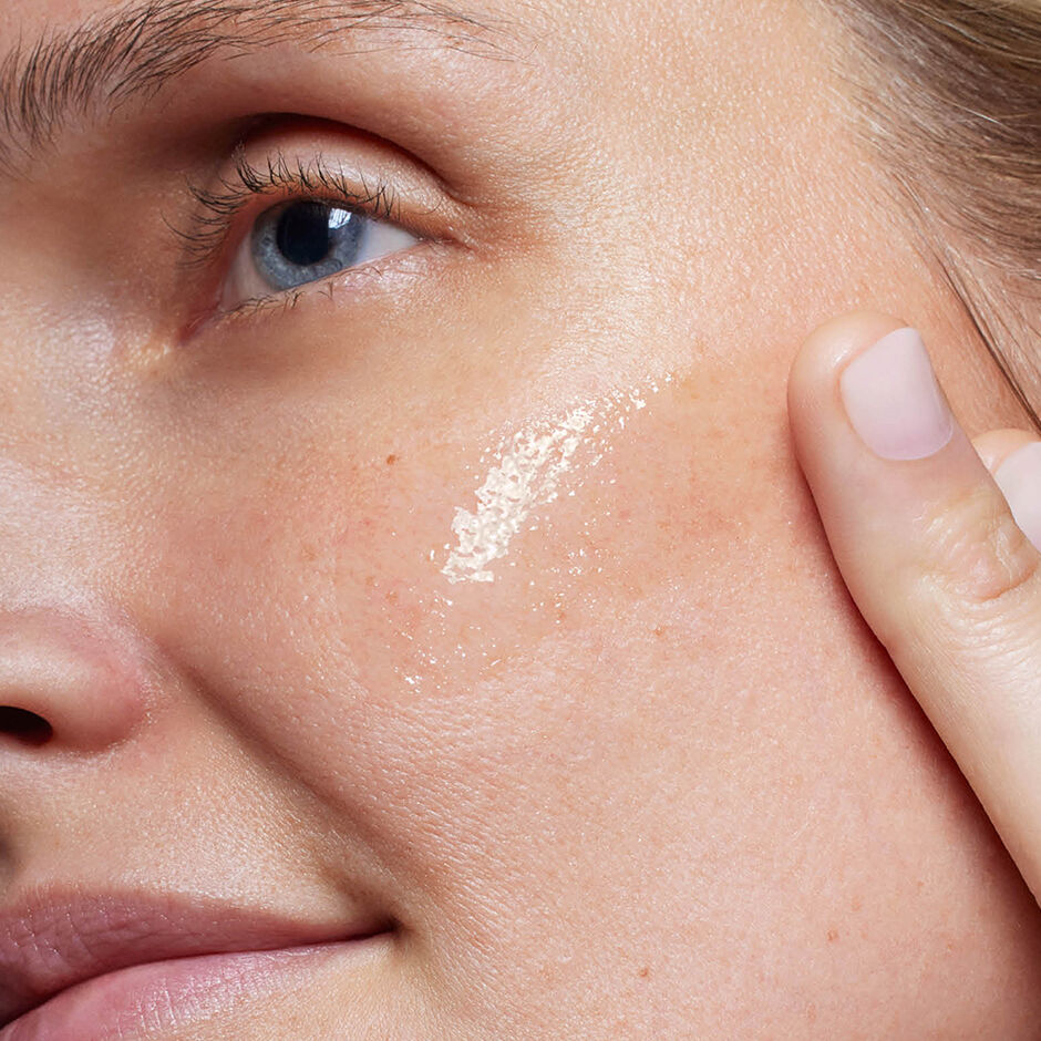 SkinCeuticals Retexturing Activator applied to the cheek