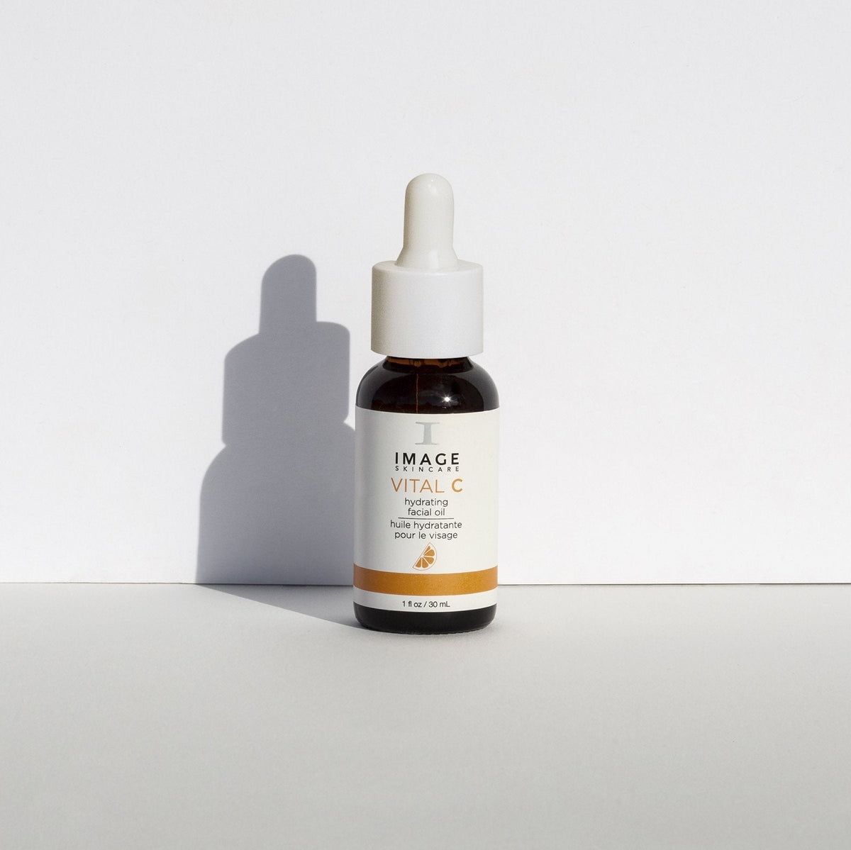 IMAGE Skincare VITAL C Hydrating Facial Oil bottle against a white wall